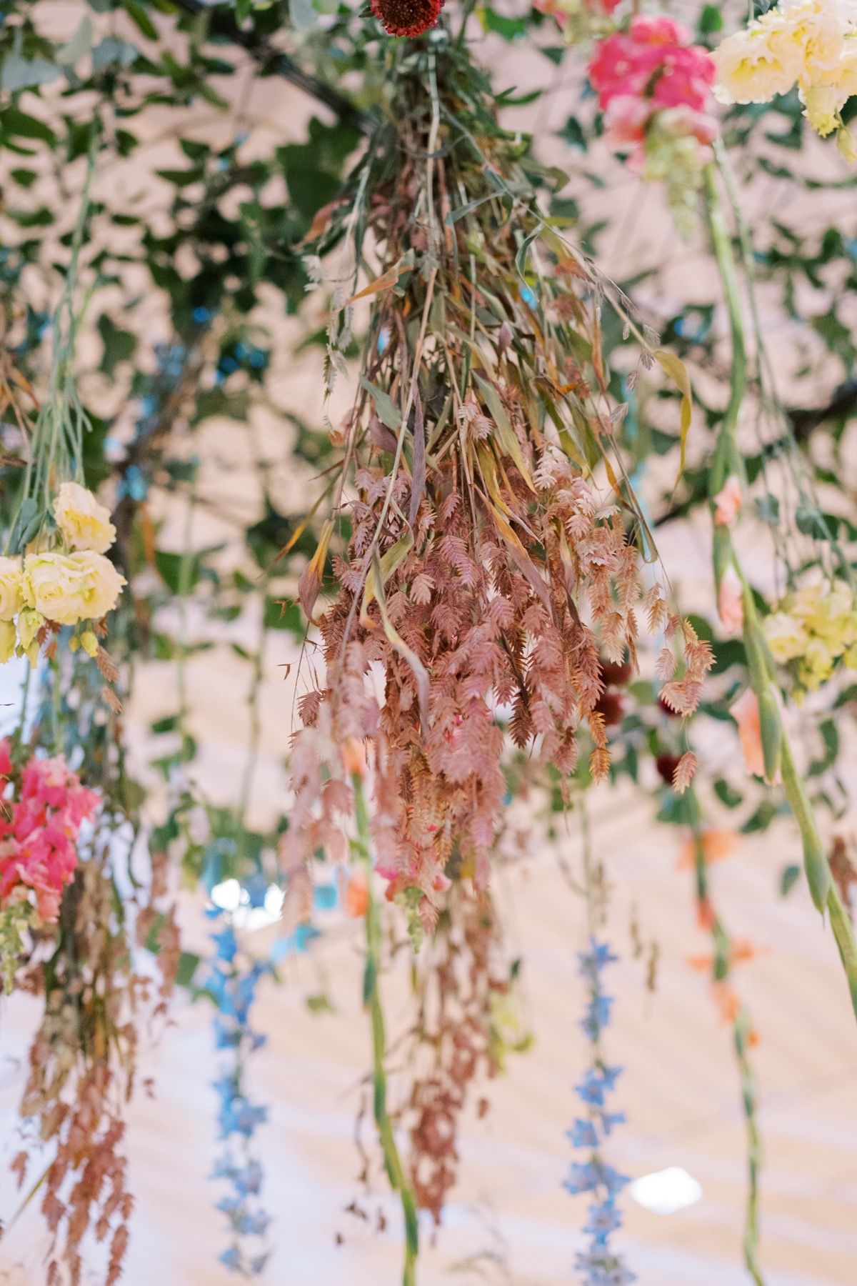 hanging grasses and flowers at wedding reception
