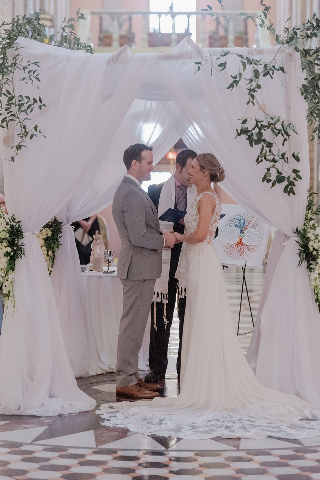 chuppah with florals and smilax