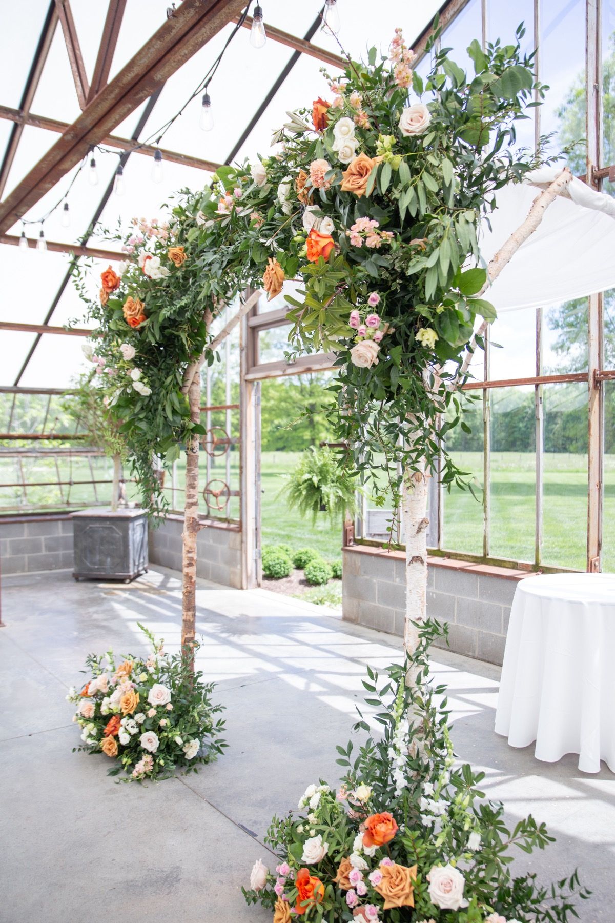 orange toned wedding arch florals columbus ohio