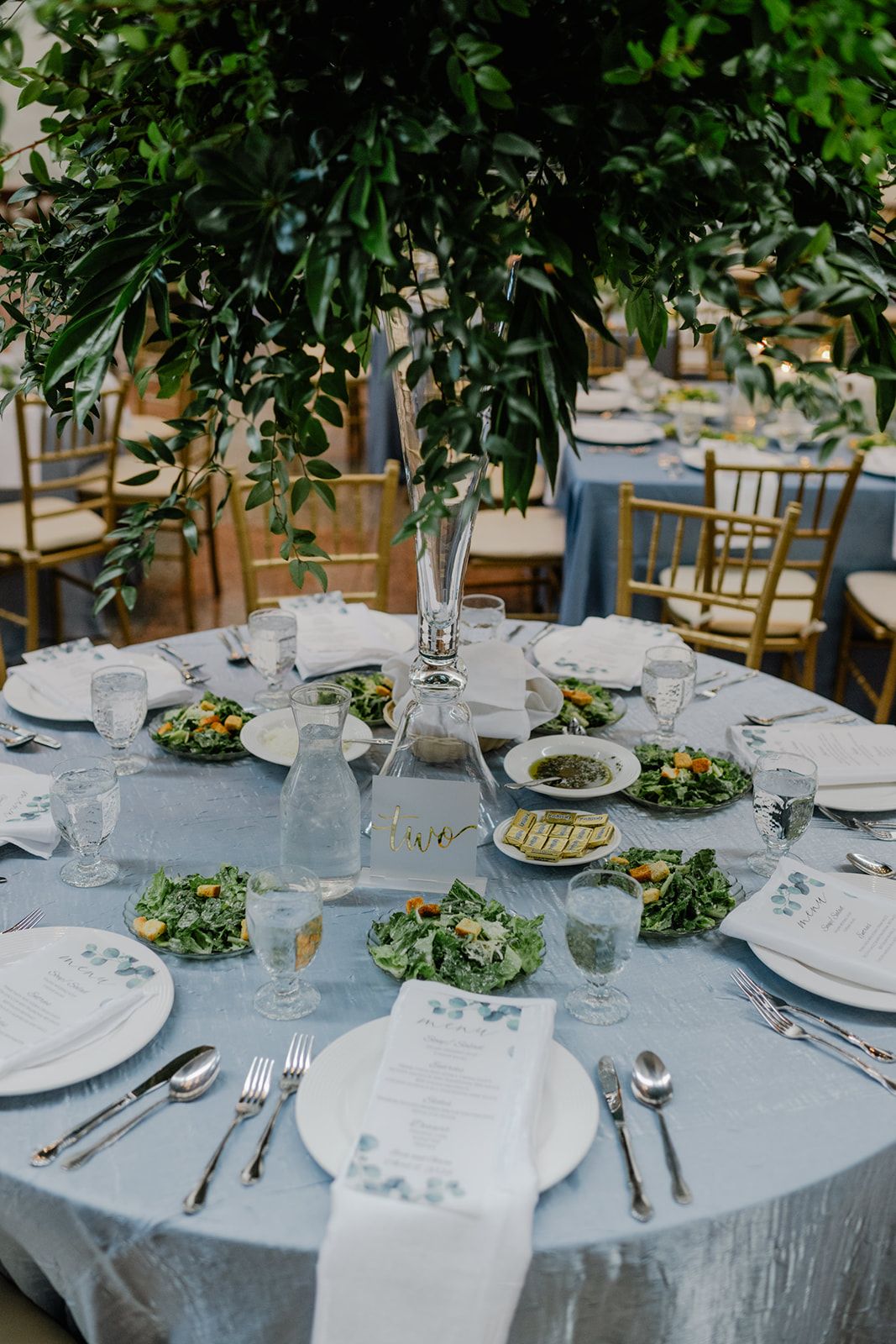 tall centerpiece of greenery