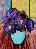 Purple flowers in a vase on a table