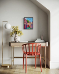 Painting of old stone walls above a desk with a vase of flowers and a chair