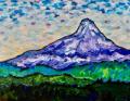 A lone mountain peak above rolling hills