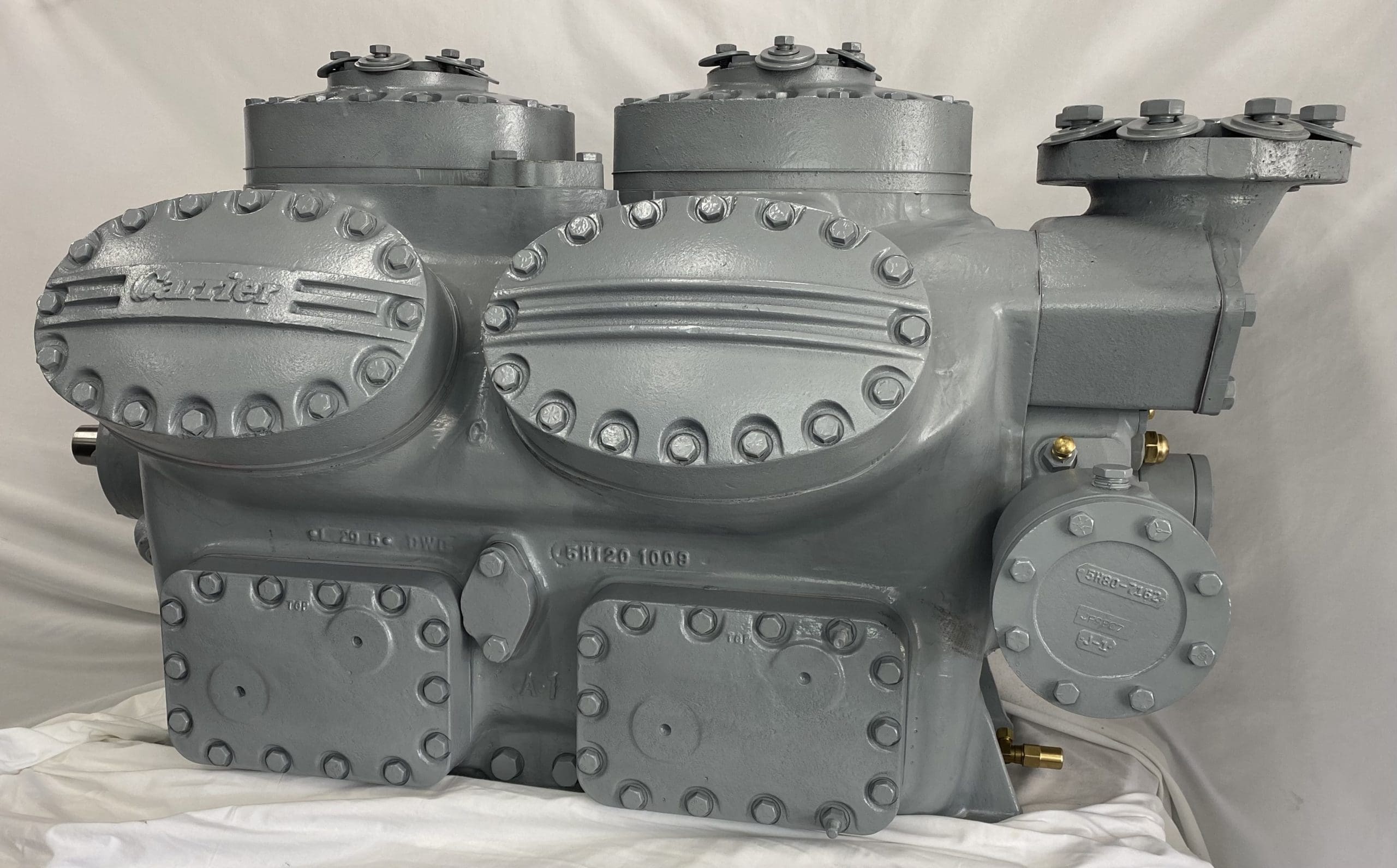 Remanufactured Carrier 5H120 open reciprocating compressor with visible branding and components.