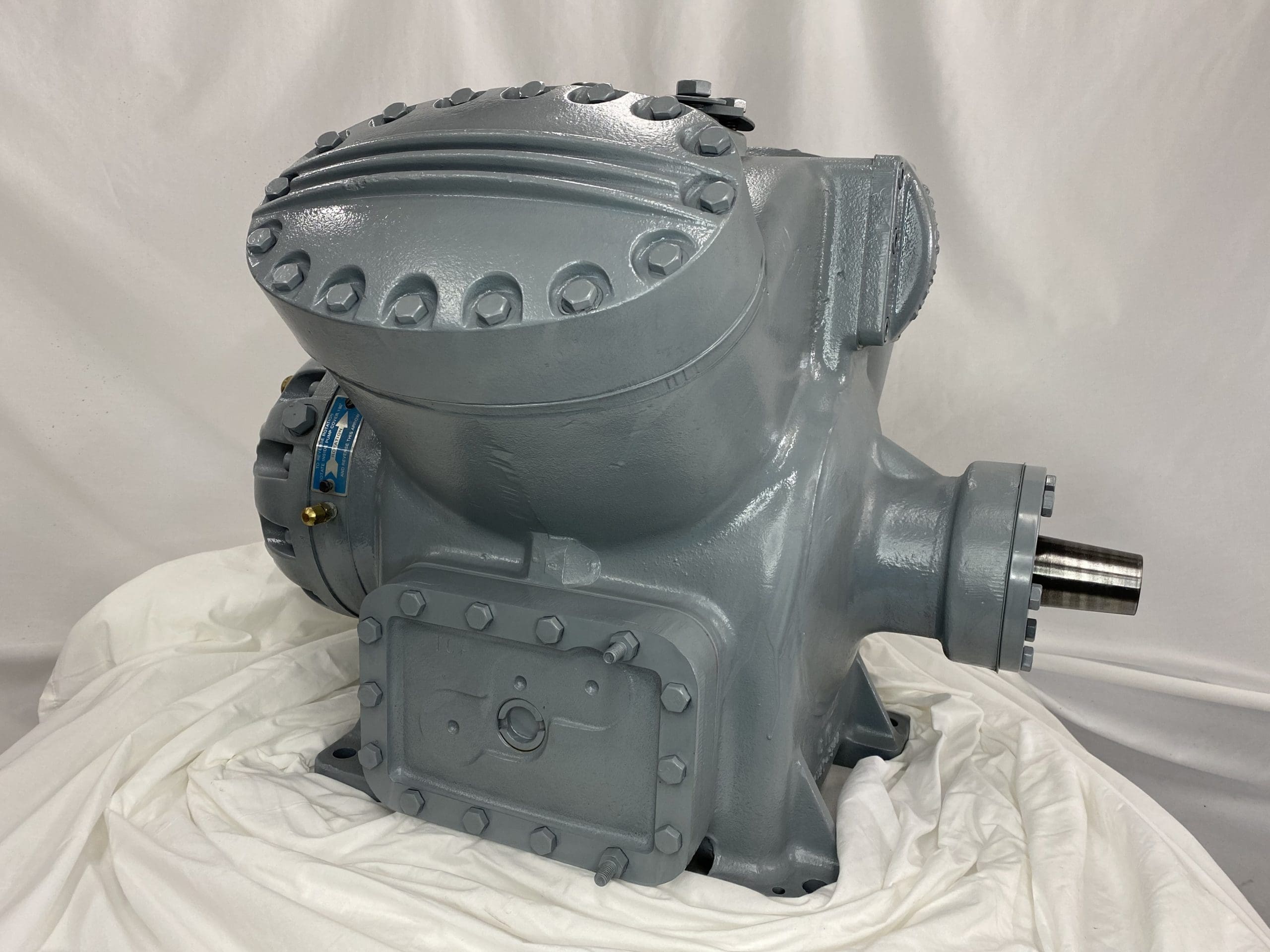 Remanufactured Carrier 5H46 open reciprocating compressor with visible components and serial plate.