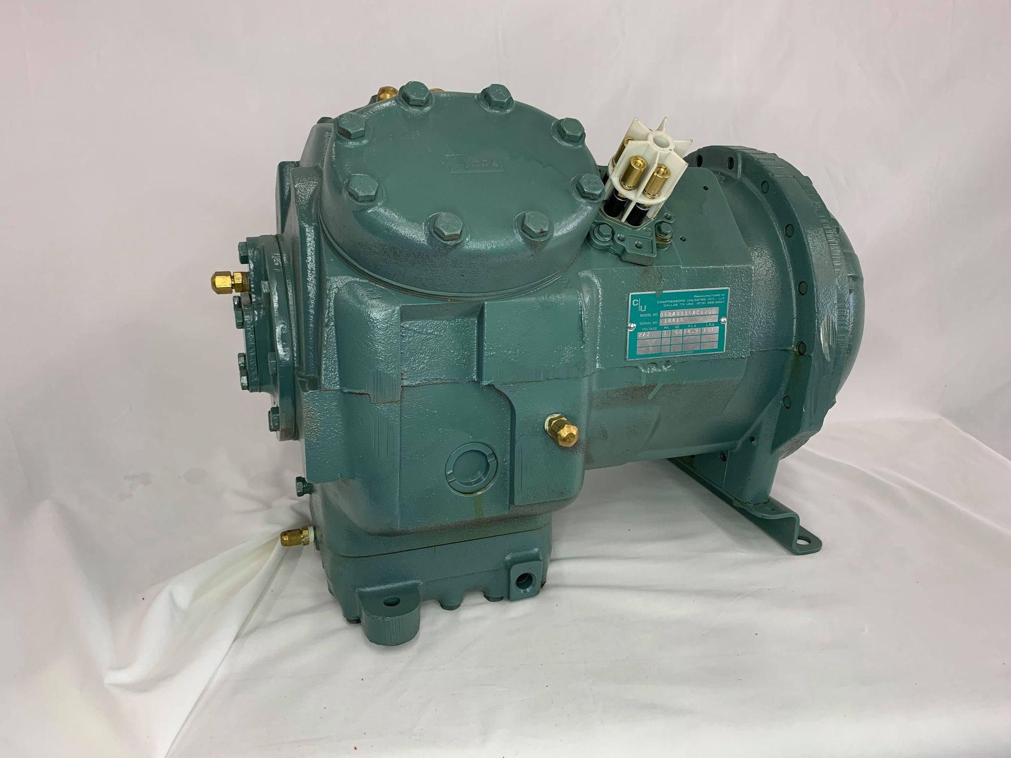 Remanufactured Carrier 06D semi-hermetic reciprocating compressor with data plate and piping.