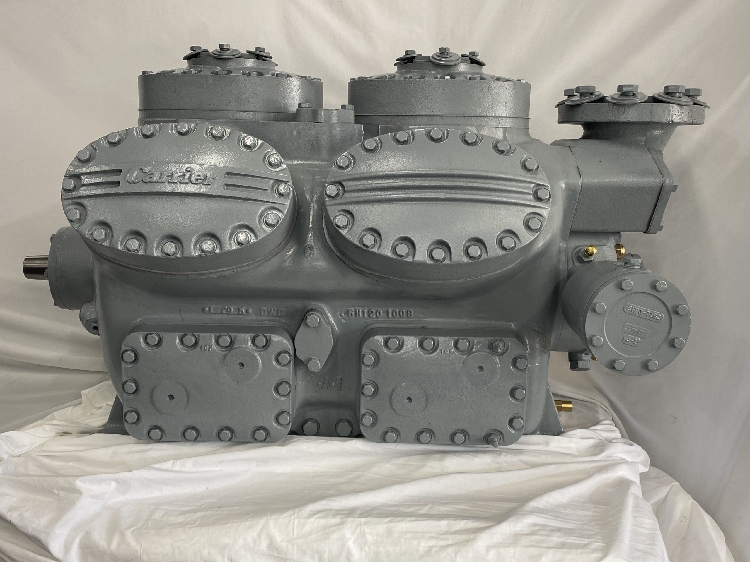 Remanufactured Carrier 5H-126 open reciprocating compressor with visible Carrier branding and components.