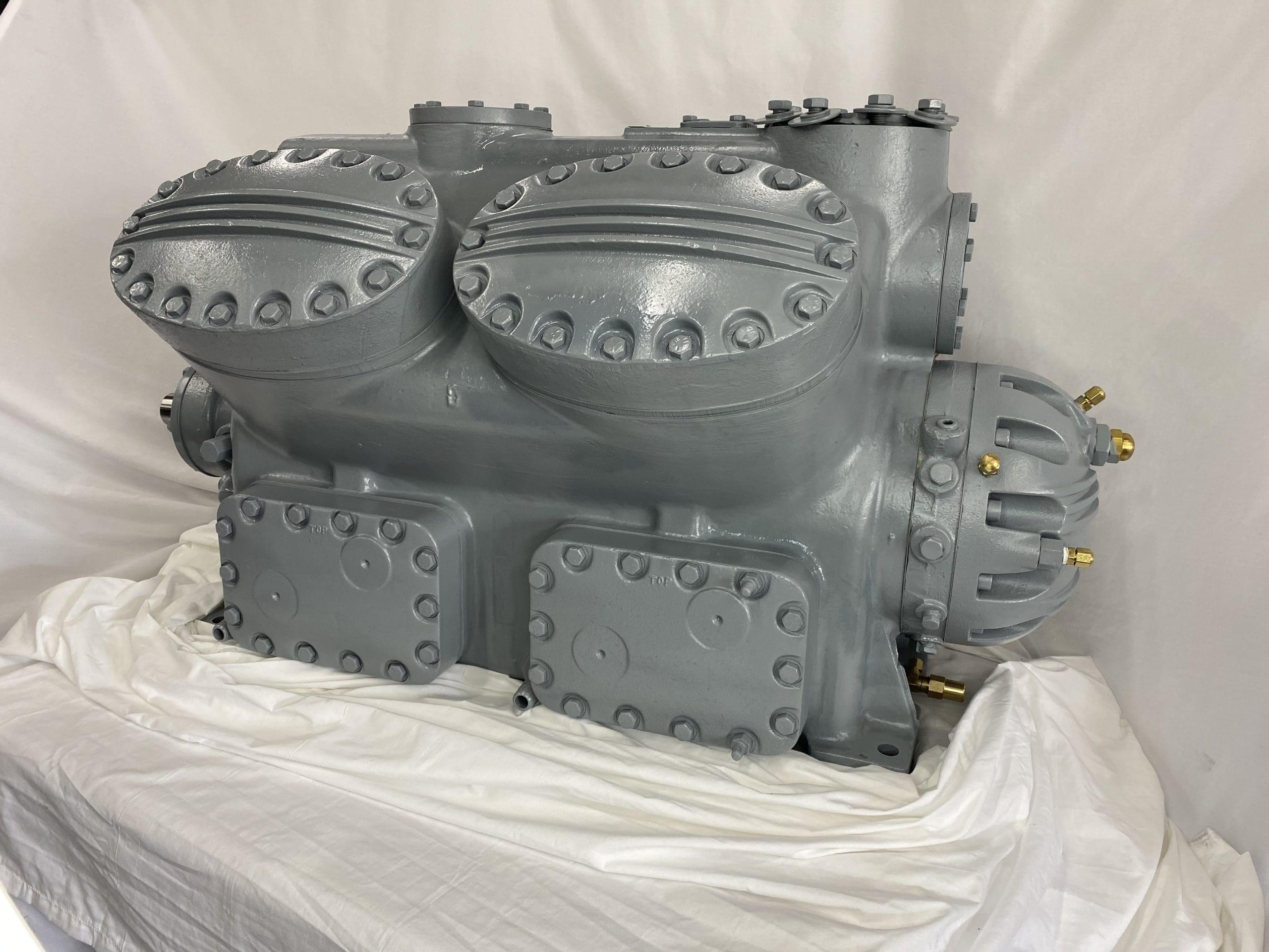Remanufactured Carrier 5H*86 open reciprocating compressor with cylinders and connections.