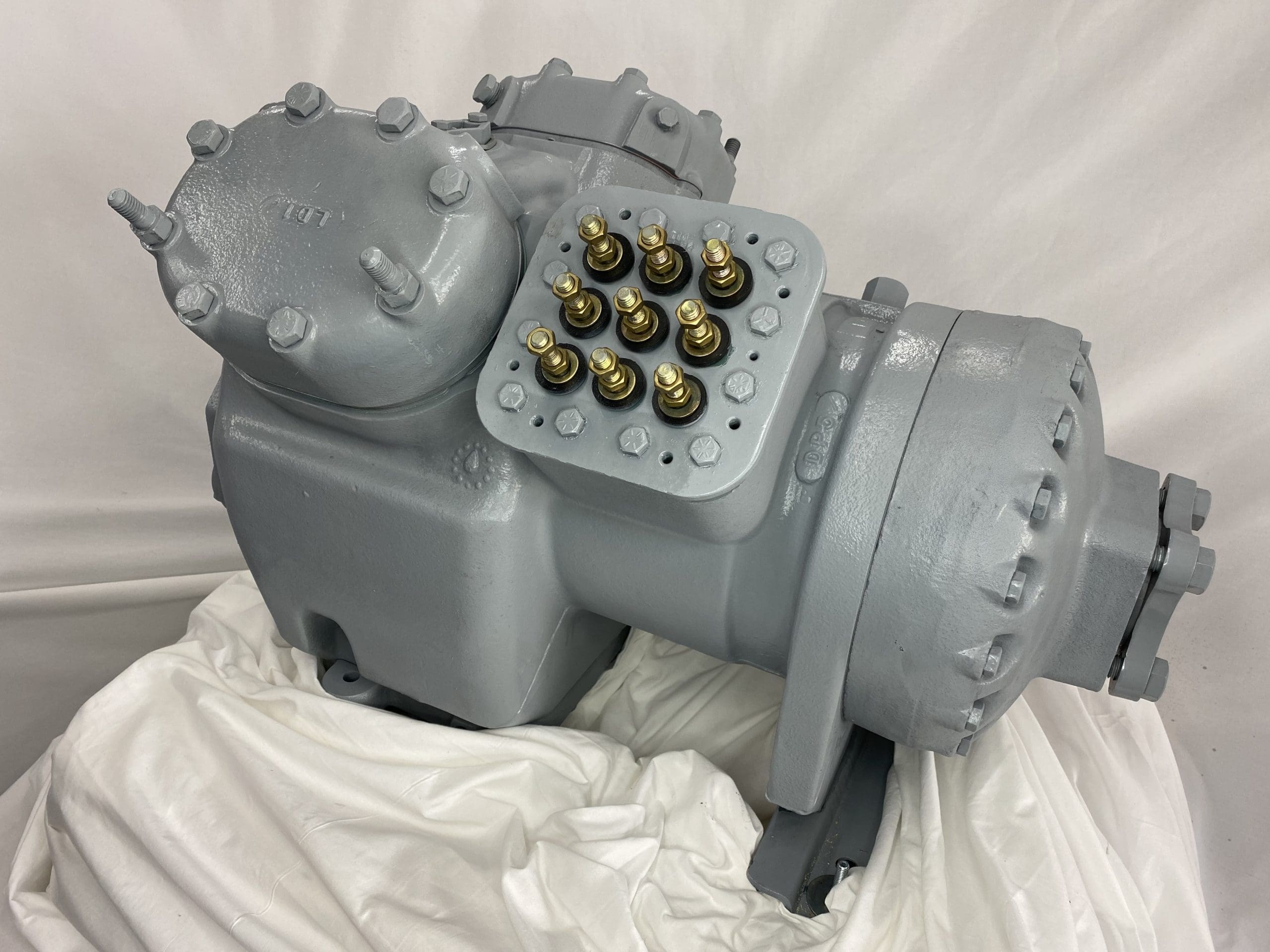 Remanufactured Carrier 06ER semi-hermetic reciprocating compressor with R-410A refrigerant connections.