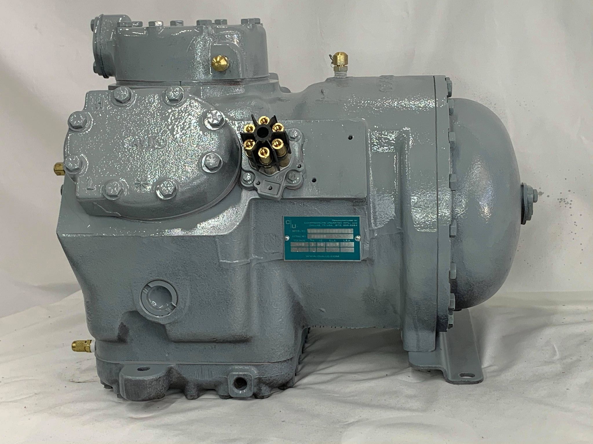 Remanufactured Carrier 06D Semi-Hermetic Reciprocating compressor with data plate, ready for commercial AC installation.