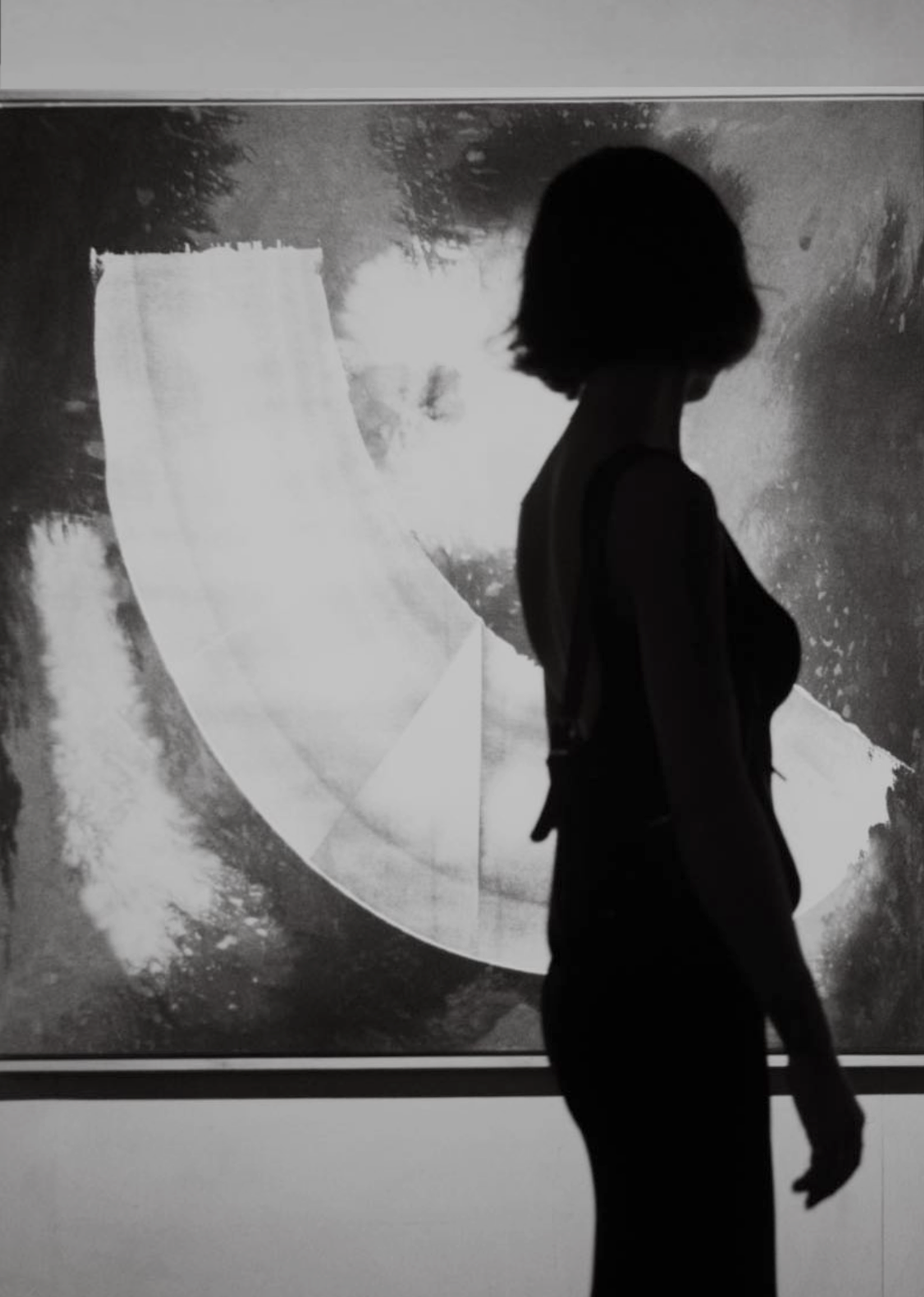 Abstract painting 'Indigo 03' by Jake Paul White, with female silhouette standing in-front, featuring natural indigo and acrylic on raw calico cotton, part of the Blue Series