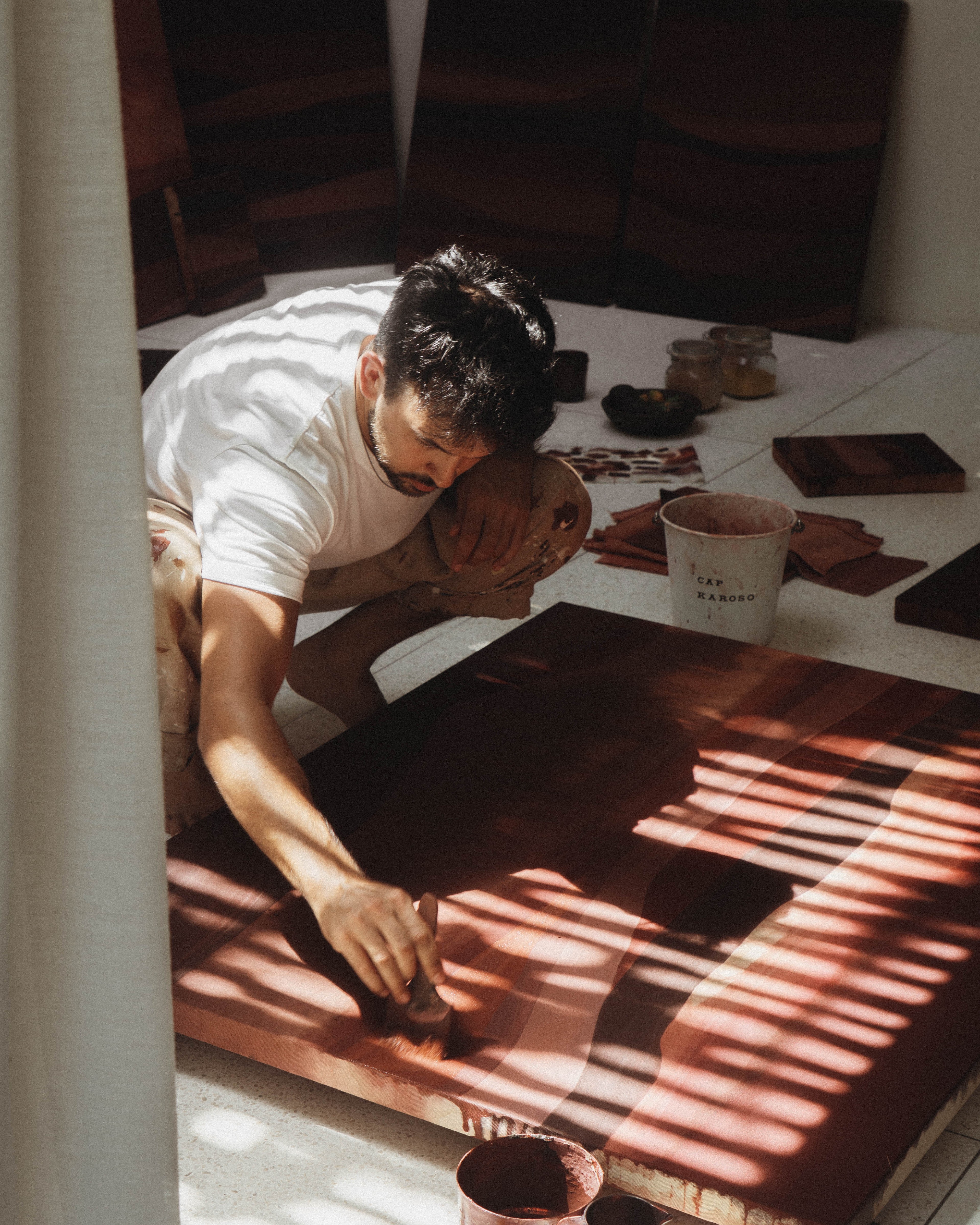 Jake Paul White painting with natural dyes on canvas during his Sumba artist residency