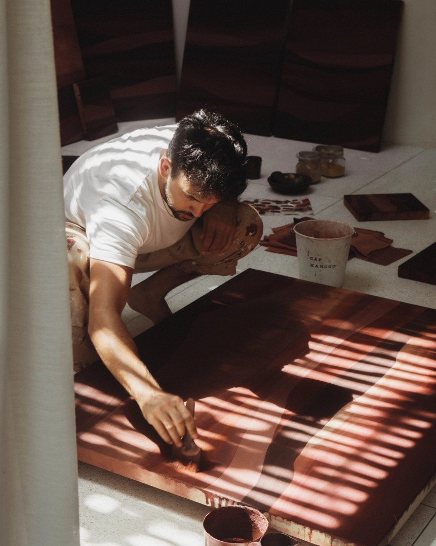Jake Paul White painting with natural dyes on canvas during his Sumba artist residency