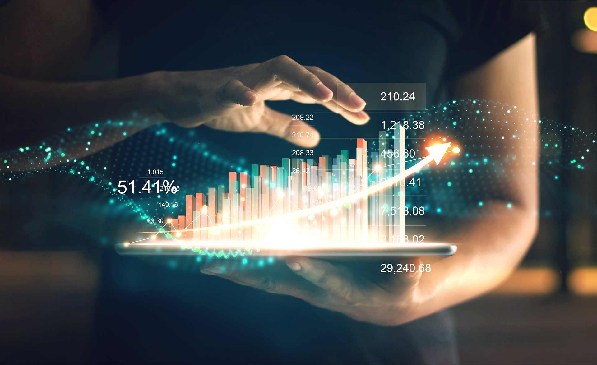 A person holds a tablet displaying glowing, holographic bar graphs and data points with a rising trend line, illustrating financial growth and data analysis powered by Sanity Studio’s advanced headless CMS for seamless content management.