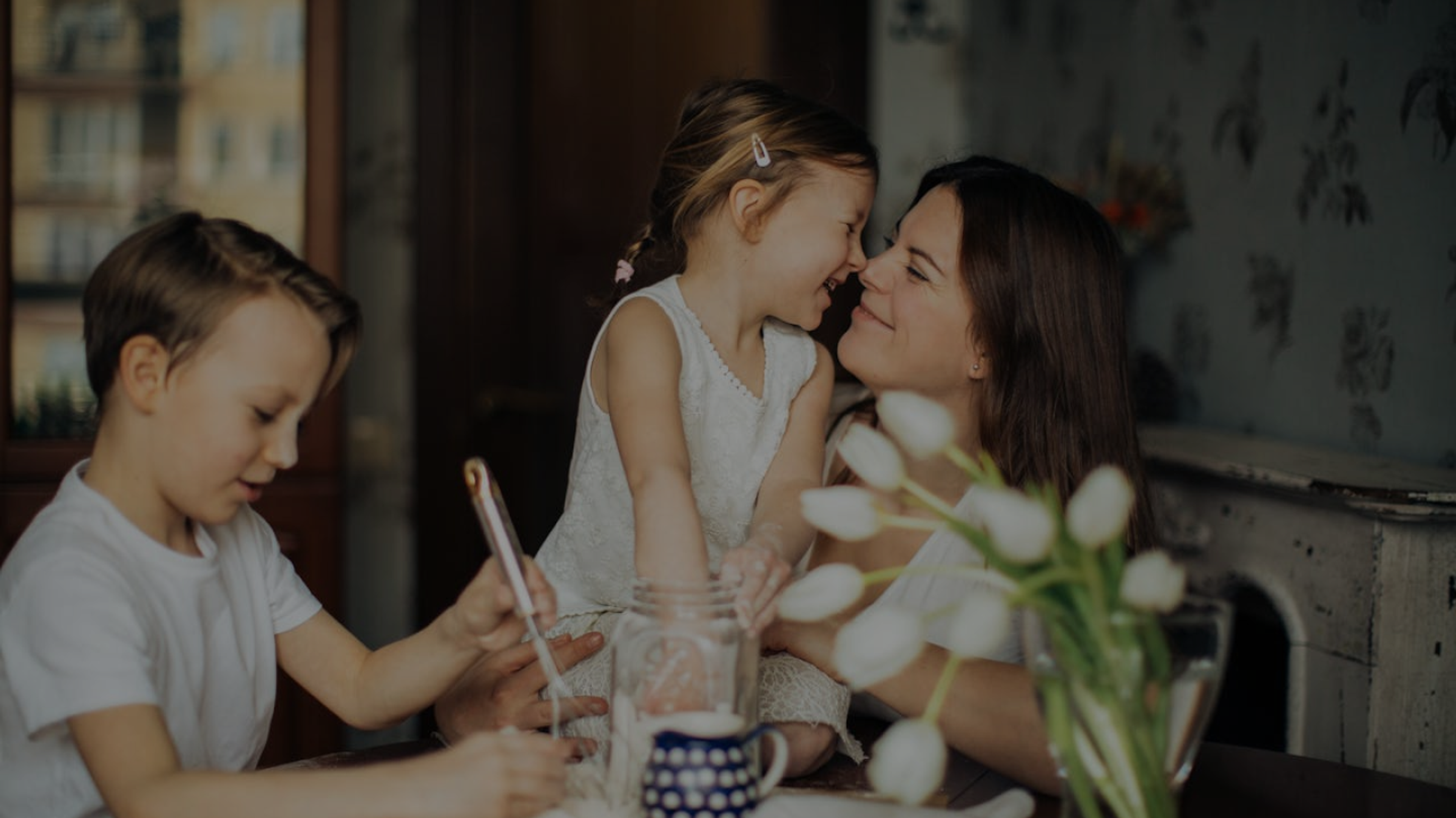 Family smiling at a table