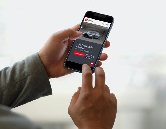 Person using the Toyota app on a smartphone