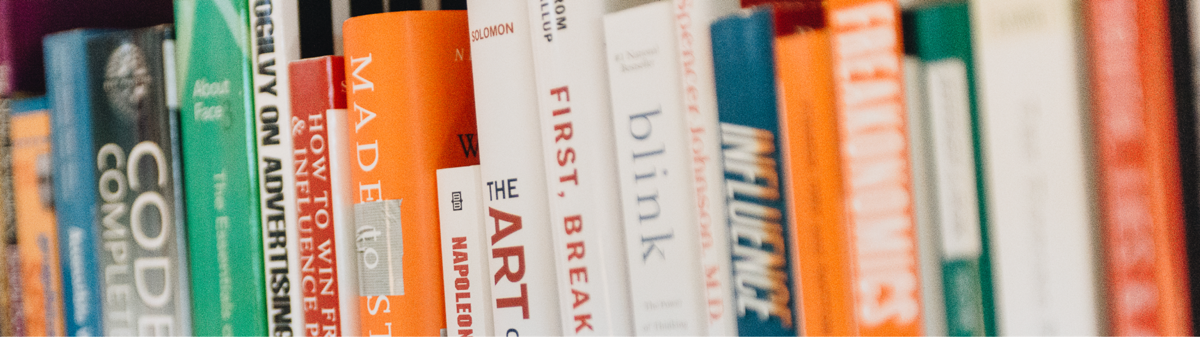 Various book spines on a shelf