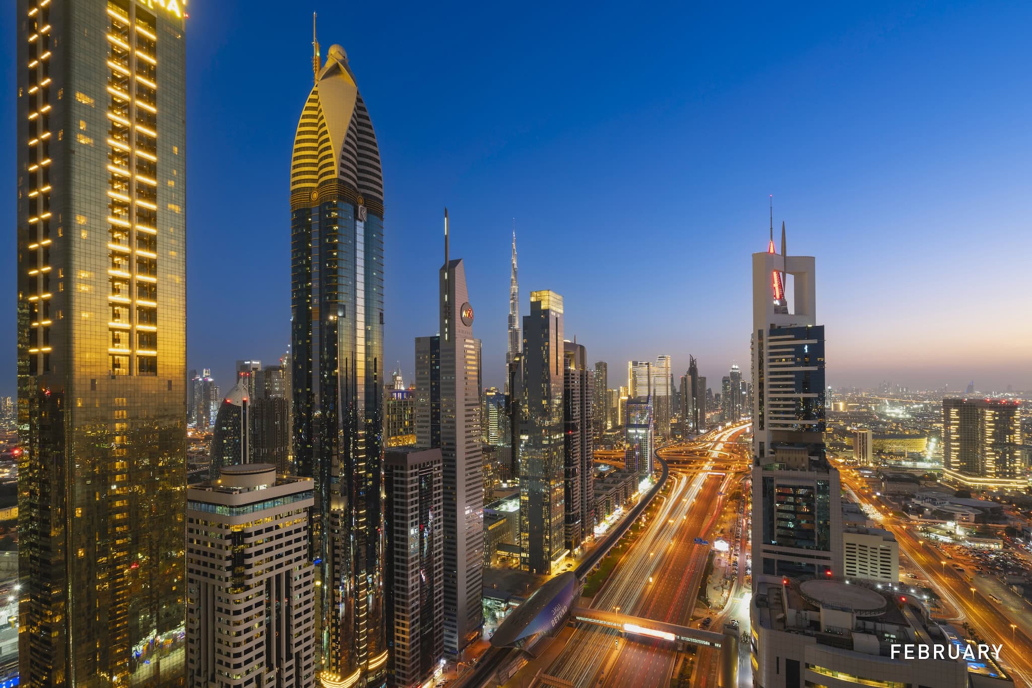 February: Downtown high-rises and traffic light trails after dark, Dubai, United Arab Emirates