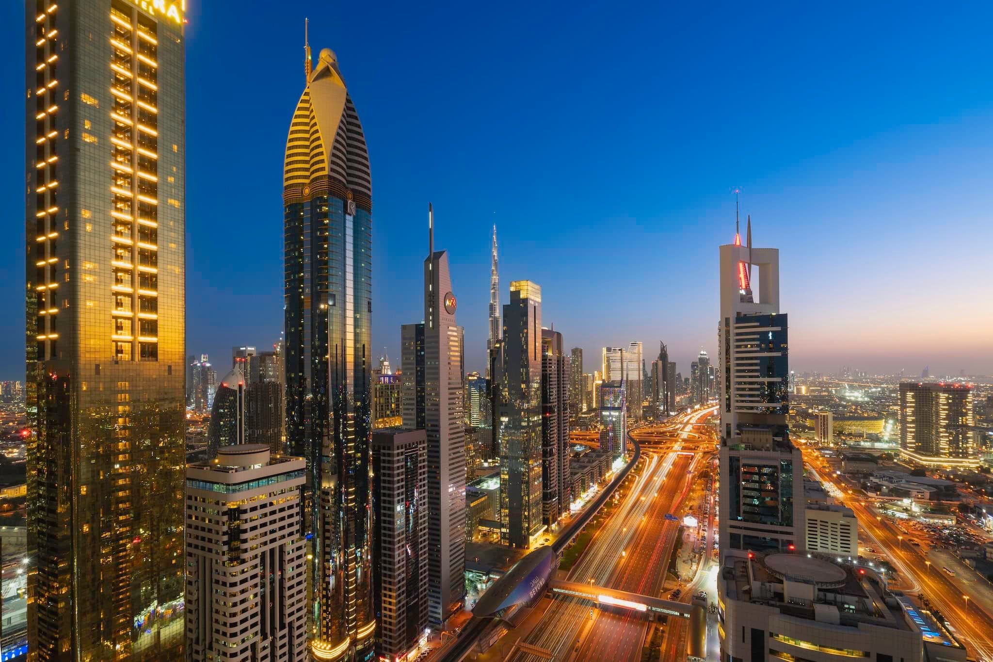 February: Downtown high-rises and traffic light trails after dark, Dubai, United Arab Emirates