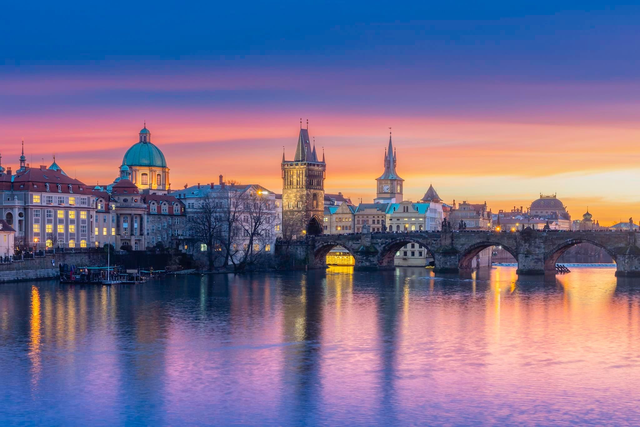 January: Charles Bridge and the Old Town skyline at sunset over the Vltava, Prague, Czech Republic