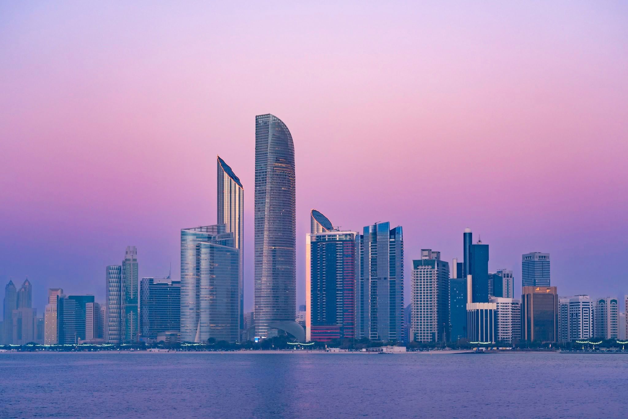 October: The waterfront skyline at dusk, Abu Dhabi, United Arab Emirates