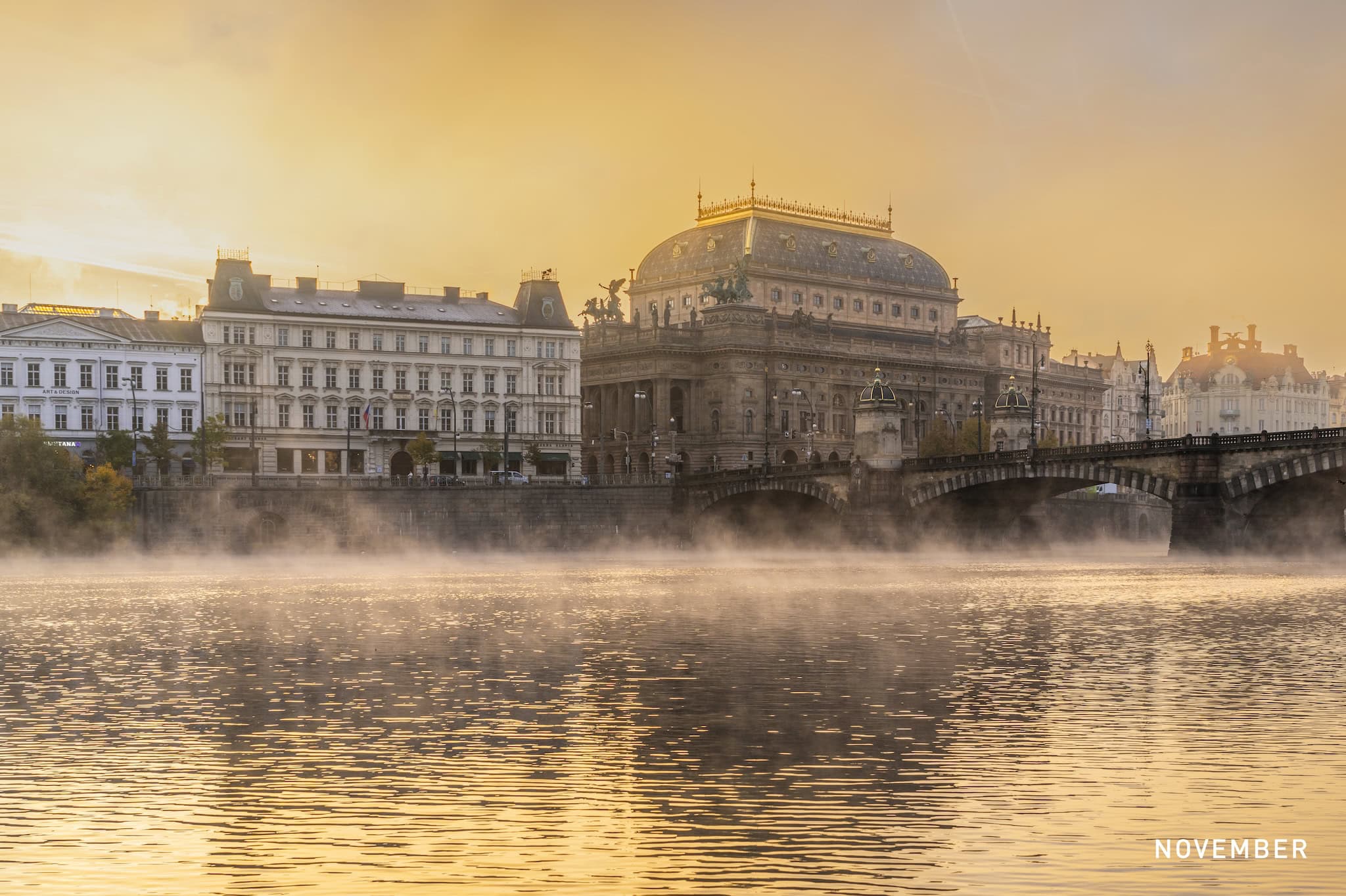 November: The National Theatre and the Vltava in morning mist, Prague, Czech Republic
