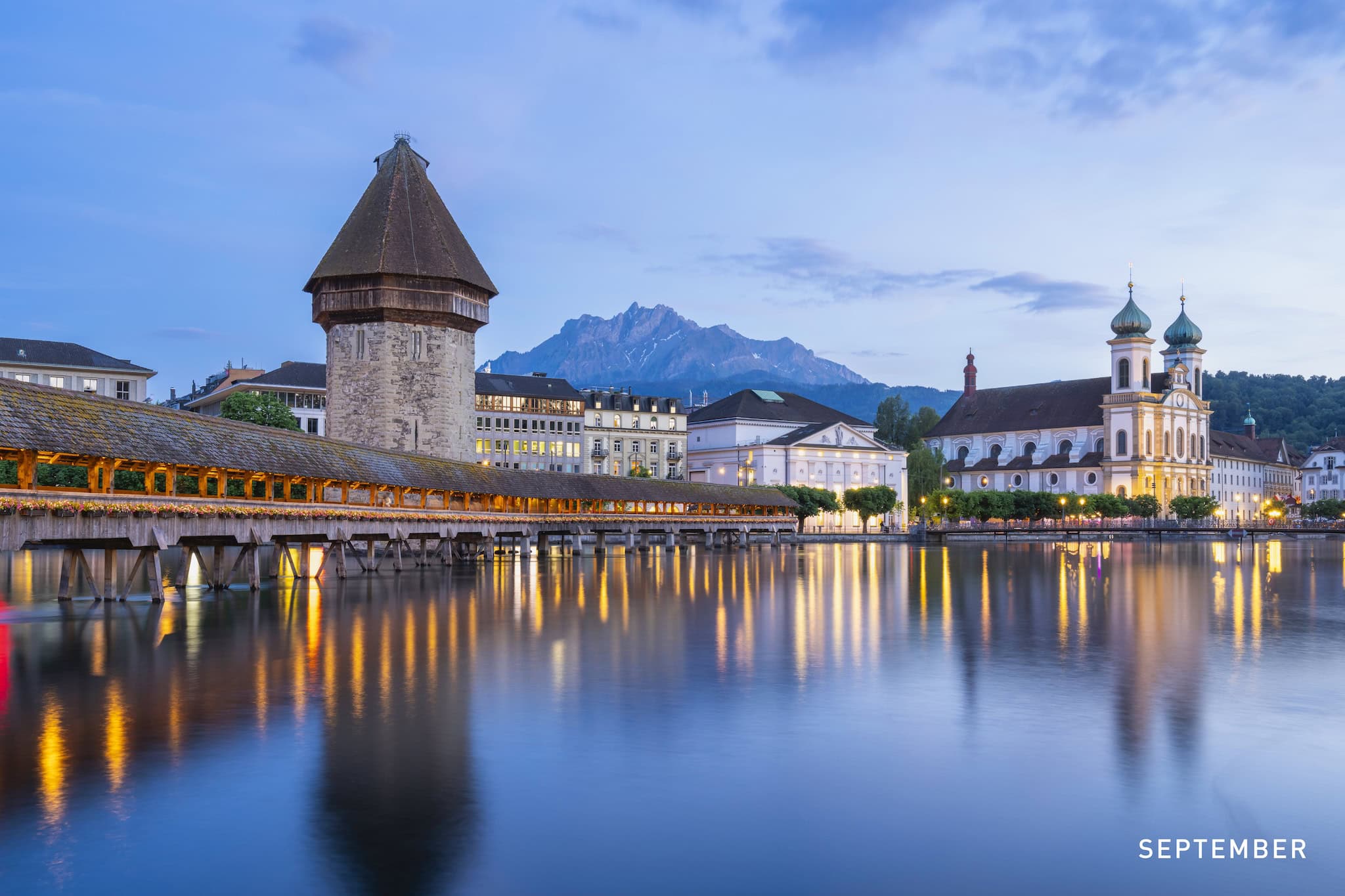 September: The Chapel Bridge and Water Tower on the Reuss at dusk, Lucerne, Switzerland