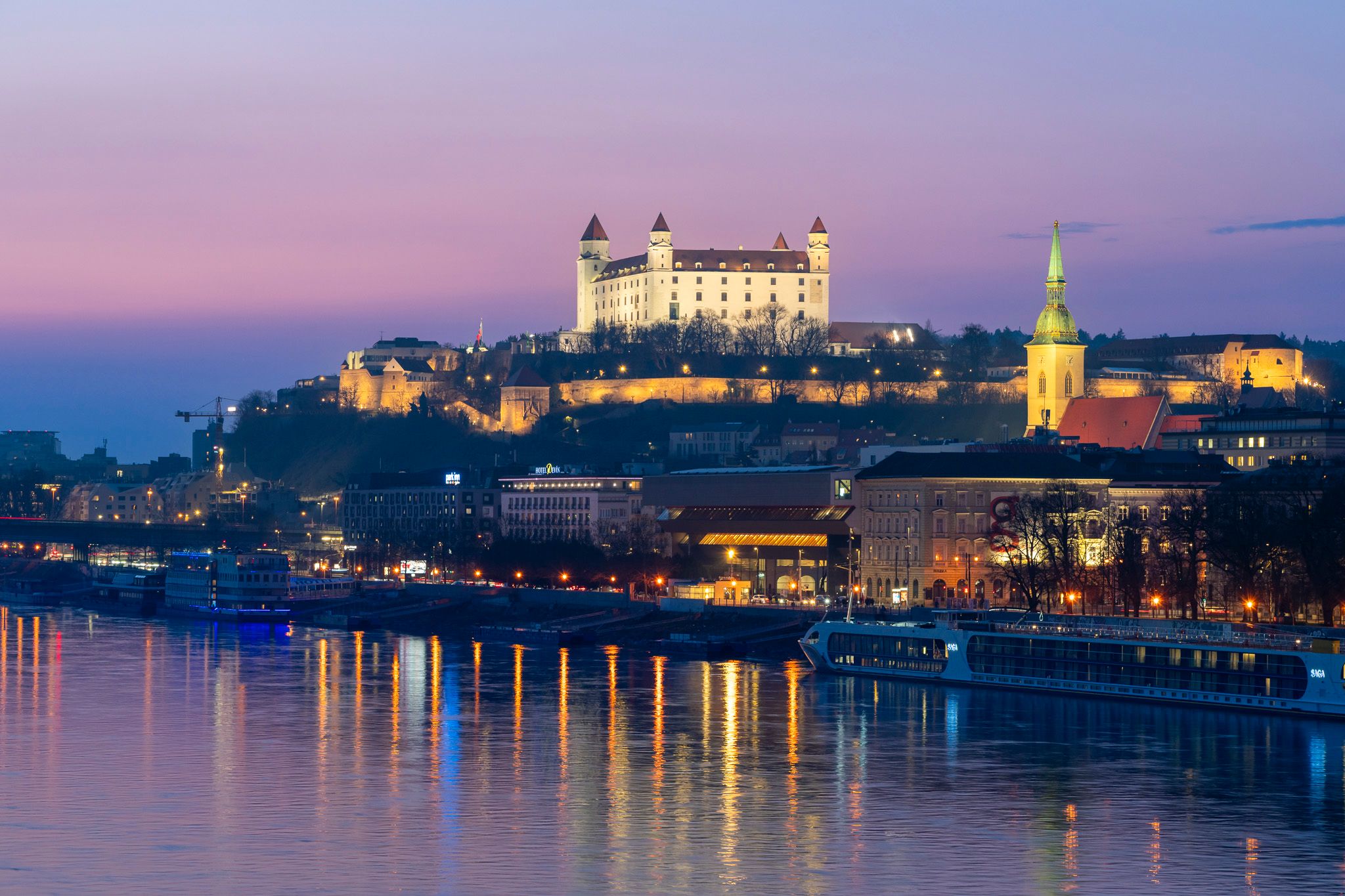Bratislava Old Town medieval architecture reflected in Danube River at blue hour