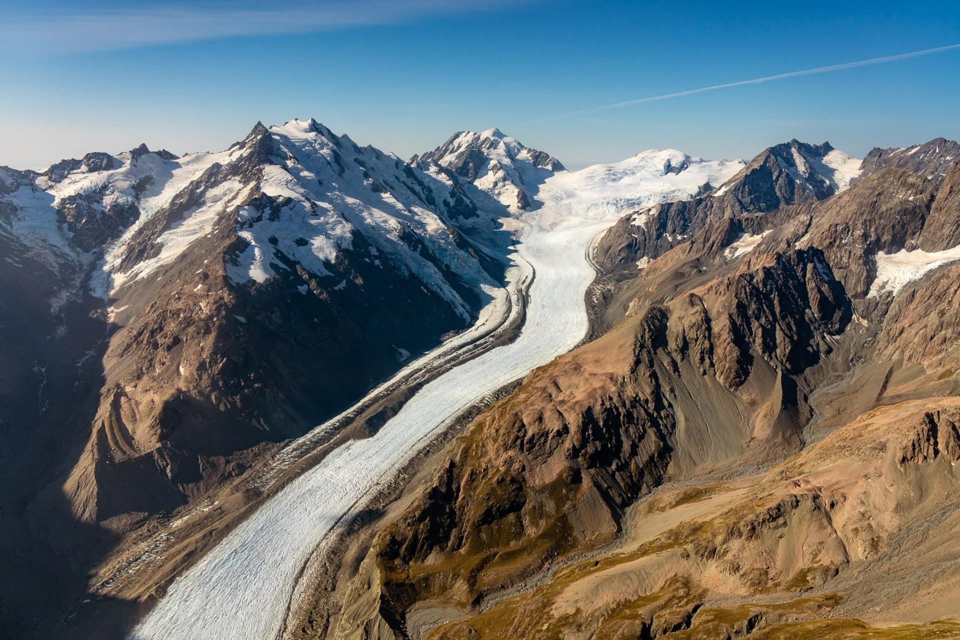 Aerial view of Tasman Glacier and mountain ranges in Aoraki / Mount Cook National Park, New Zealand