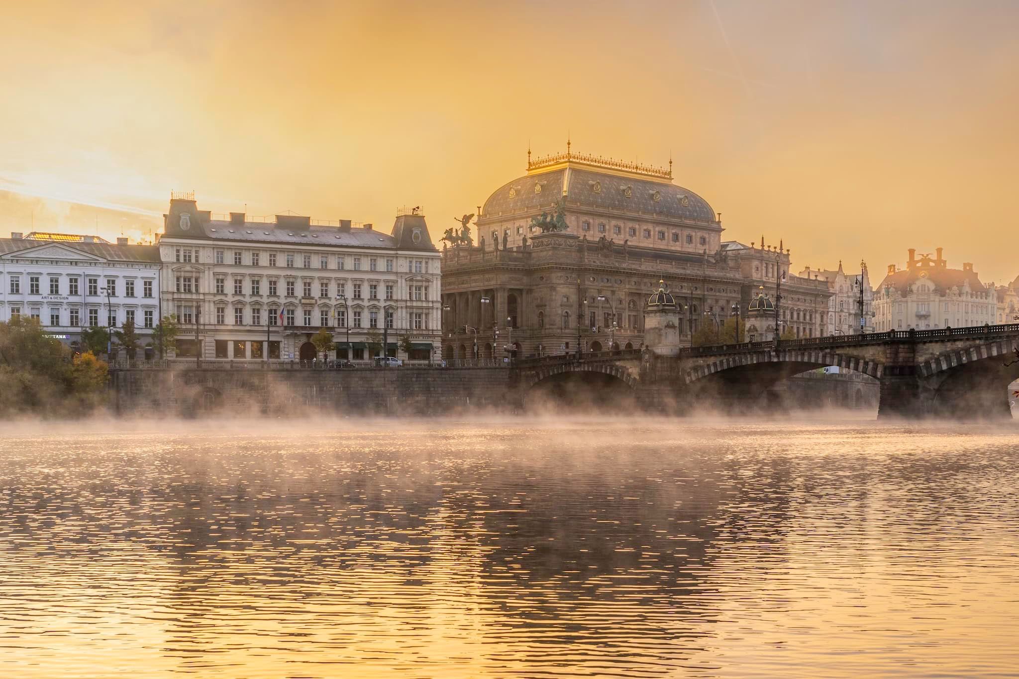 November: The National Theatre and the Vltava in morning mist, Prague, Czech Republic