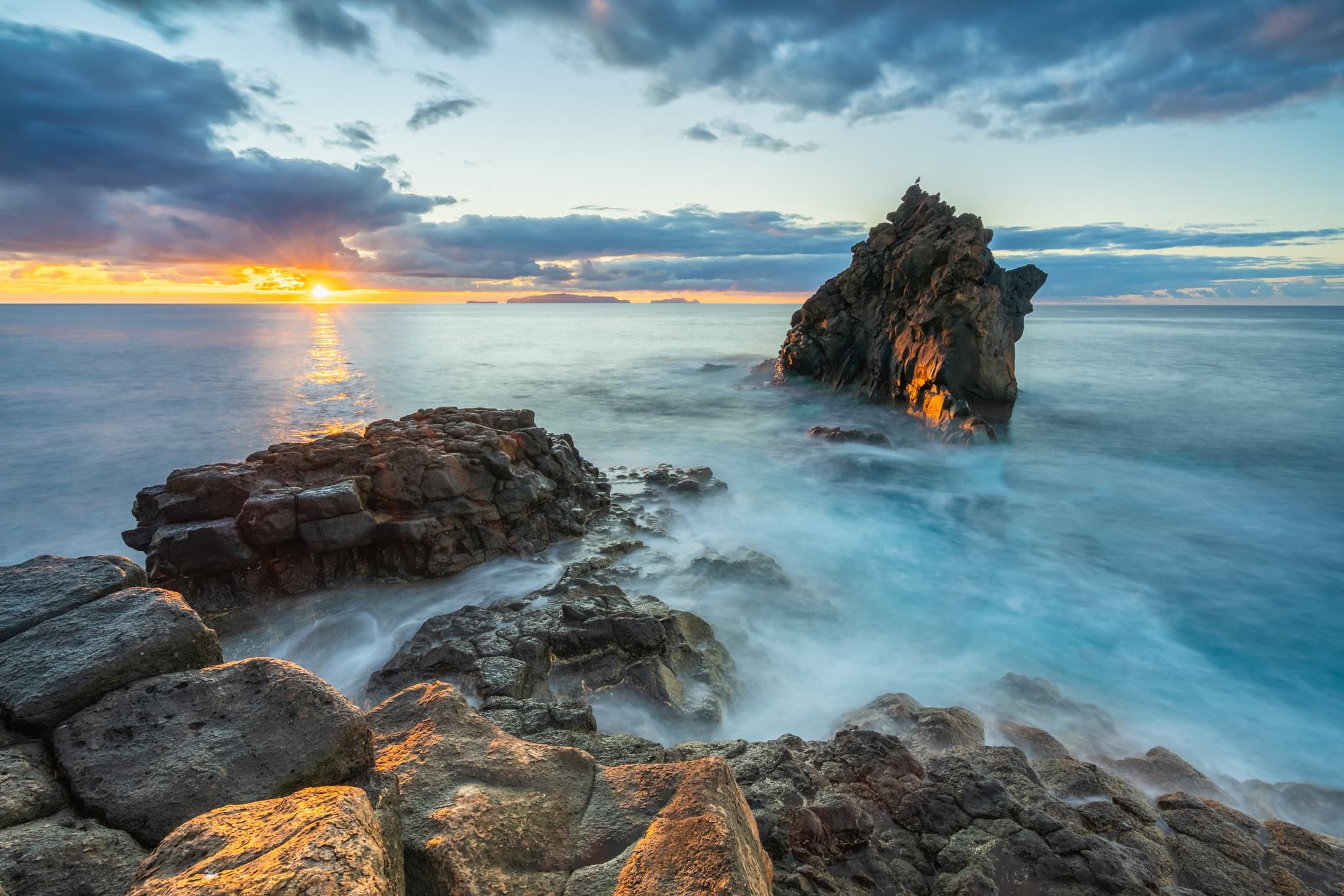 Rocky coastline with sea stacks at sunrise, Santa Cruz, Madeira, Portugal