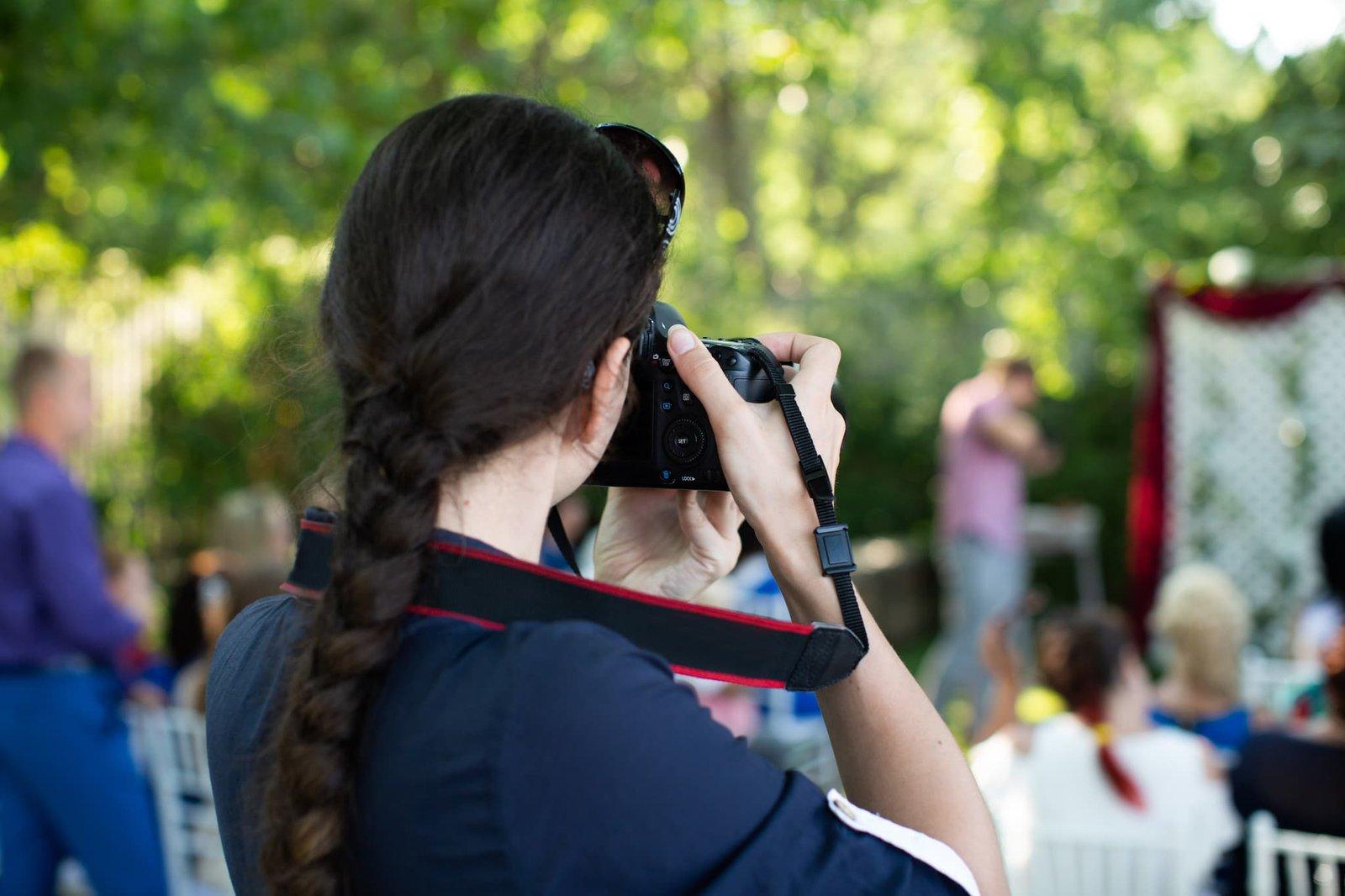 Wedding photographer shooting a wedding ceremony