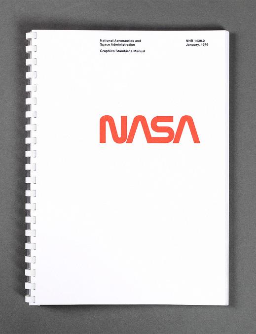 Image of the cover of a spiral-bound document titled "National Aeronautics and Space Administration Graphics Standards Manual." The cover is minimalist, with the iconic NASA logo in red at the center against a plain white background. The text and logo are in a simple, bold typeface, and the date "January, 1976" is noted underneath the manual's title, indicating the document's vintage.