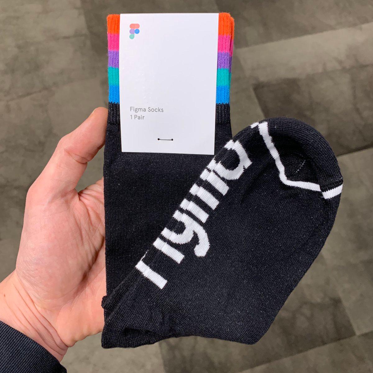 Hand holding Figma socks