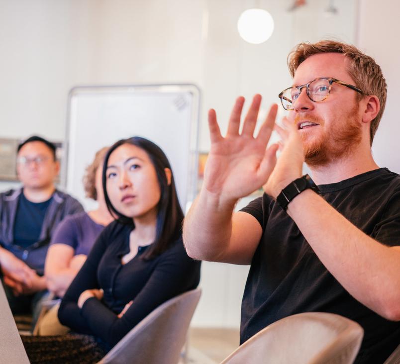 people in discussion at a conference table