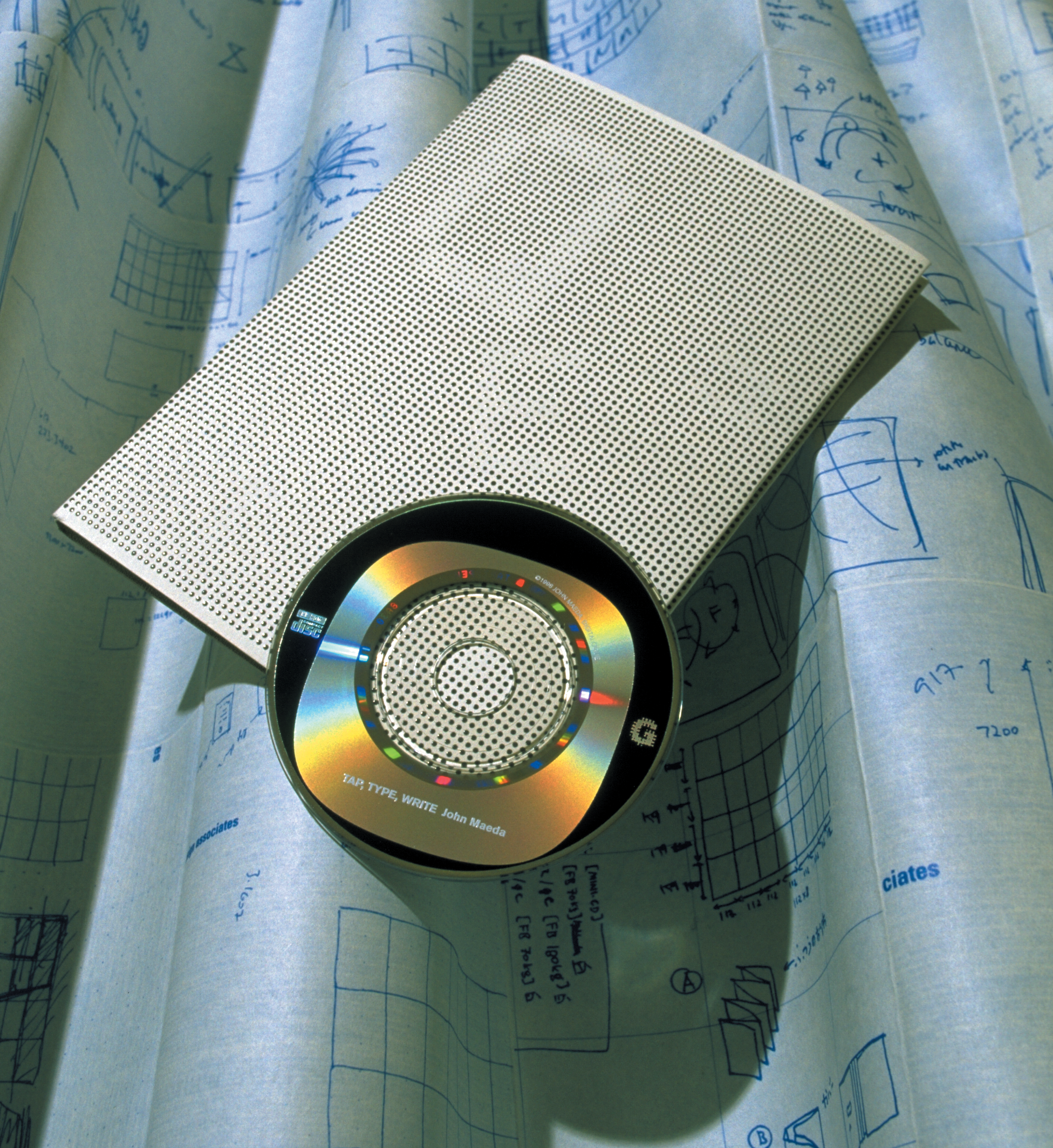 CD ROM and program sitting on a printed blueprint