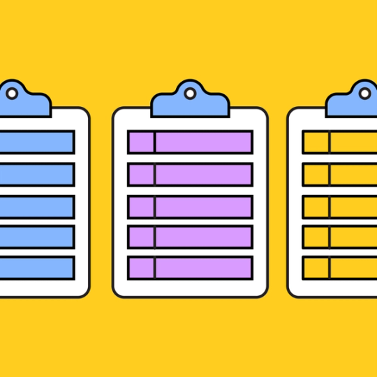 three clipboards with colorful paper