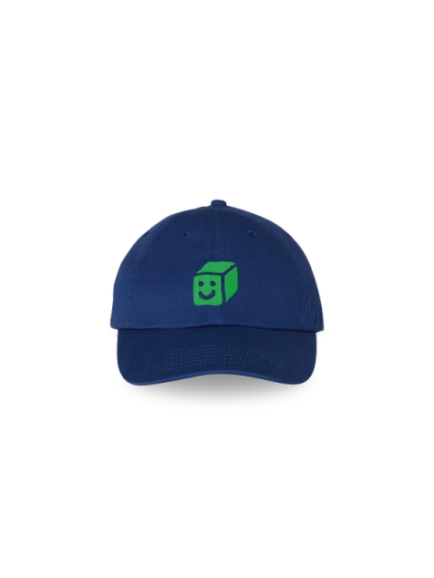 A green smiling cube embroidered on a navy baseball cap