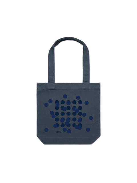 Dark blue circles of varying sizes scattered in a loose cluster on a dark gray tote bag with the Figma logo