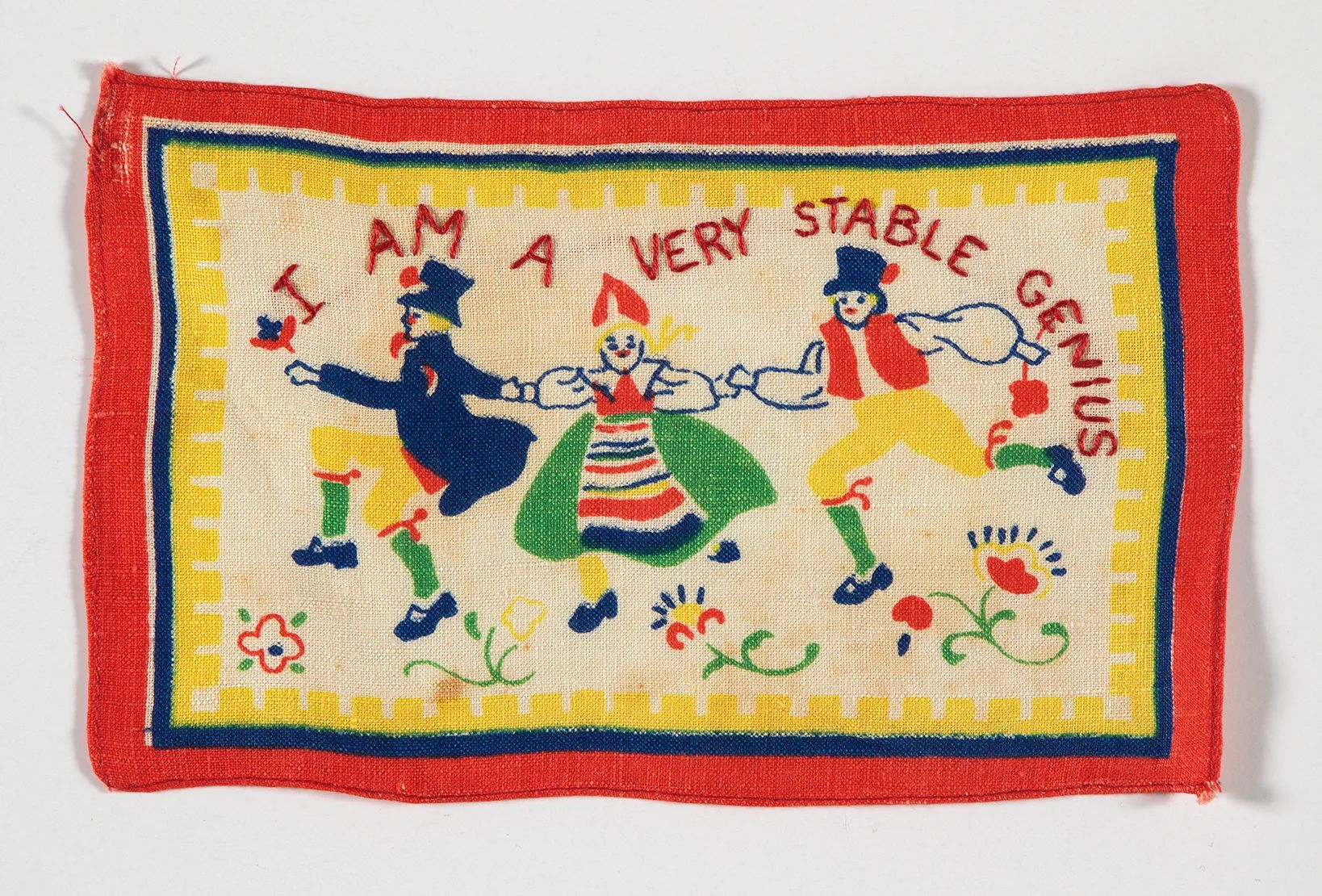 A vibrant embroidered needlepoint depicting a lively scene of people dancing in colorful attire.