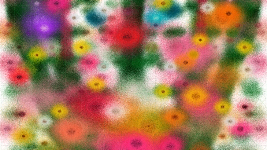 Colorful abstract image of soft, speckled flower-like bursts in pink, yellow, green, orange, and purple scattered across the frame.