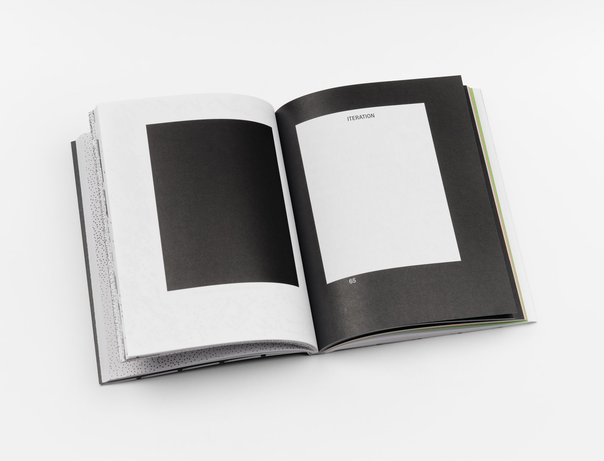 Titled "Iteration", this spread uses high-contrast black and white with a minimalist layout, suggesting a thematic or conceptual break.