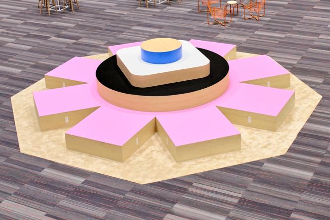 An aerial image of a large pink asterisk structure, with smaller circle and square shapes on top. There are neighboring chairs surrounding the structure, showing that comparatively, this asterisk structure is high enough for seating.