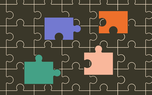 four colorful puzzle pieces on top of a black background