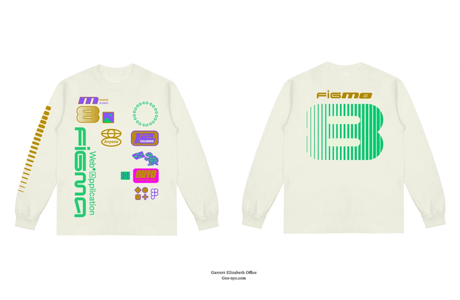 White long sleeve shirt with colorful retro graphics on front, including icons, text, and bold green striped “B” on back.