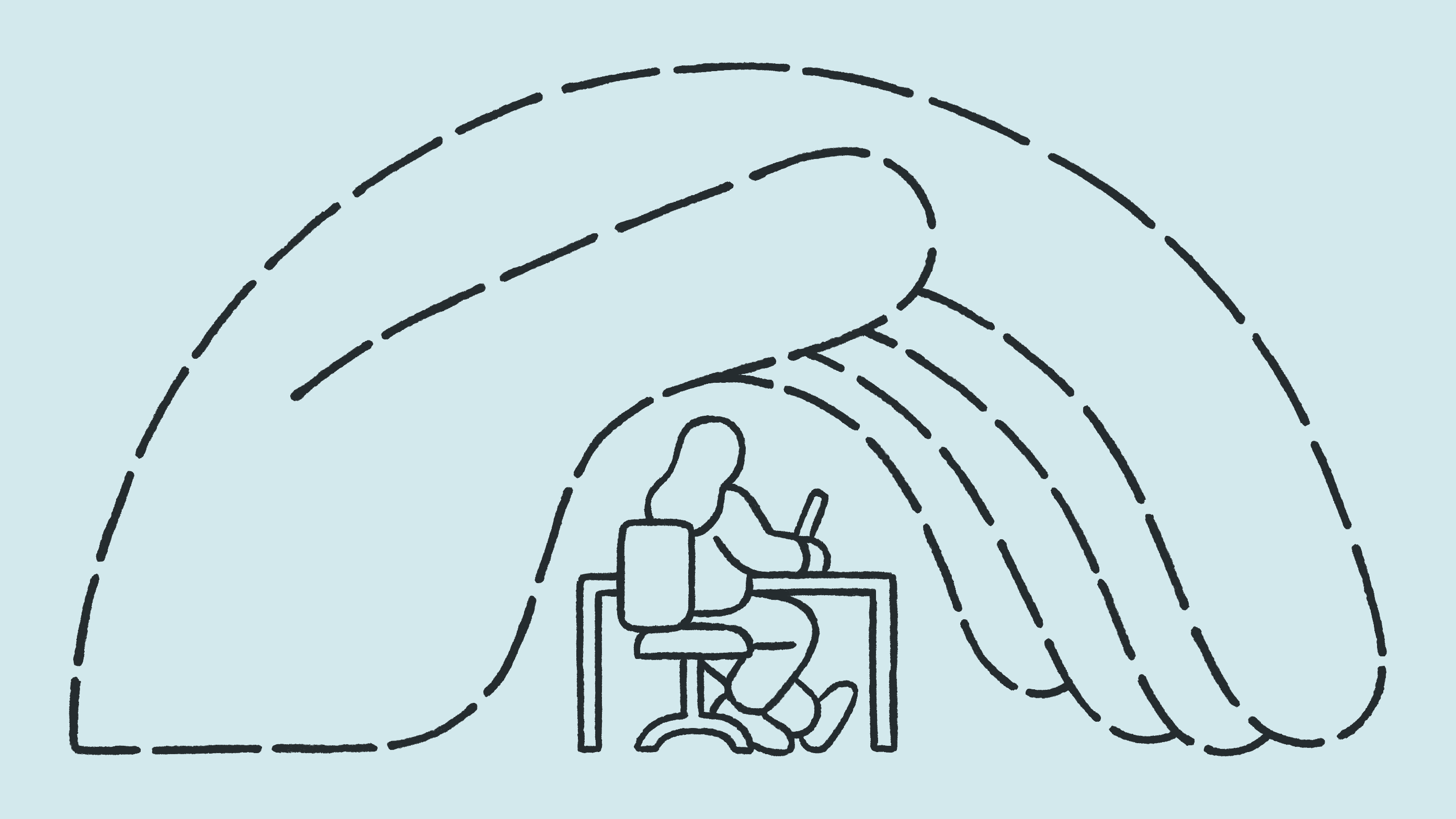 A hand is holding a person at a desk working