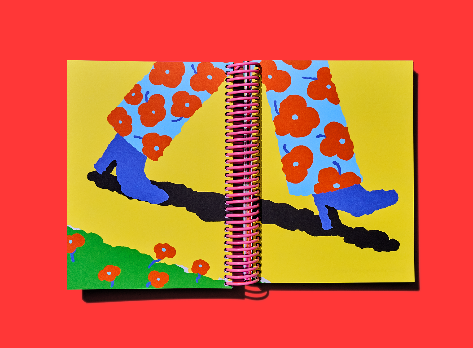 Full-bleed illustration of flower-patterned legs balancing on a branch across an open spiral-bound spread.