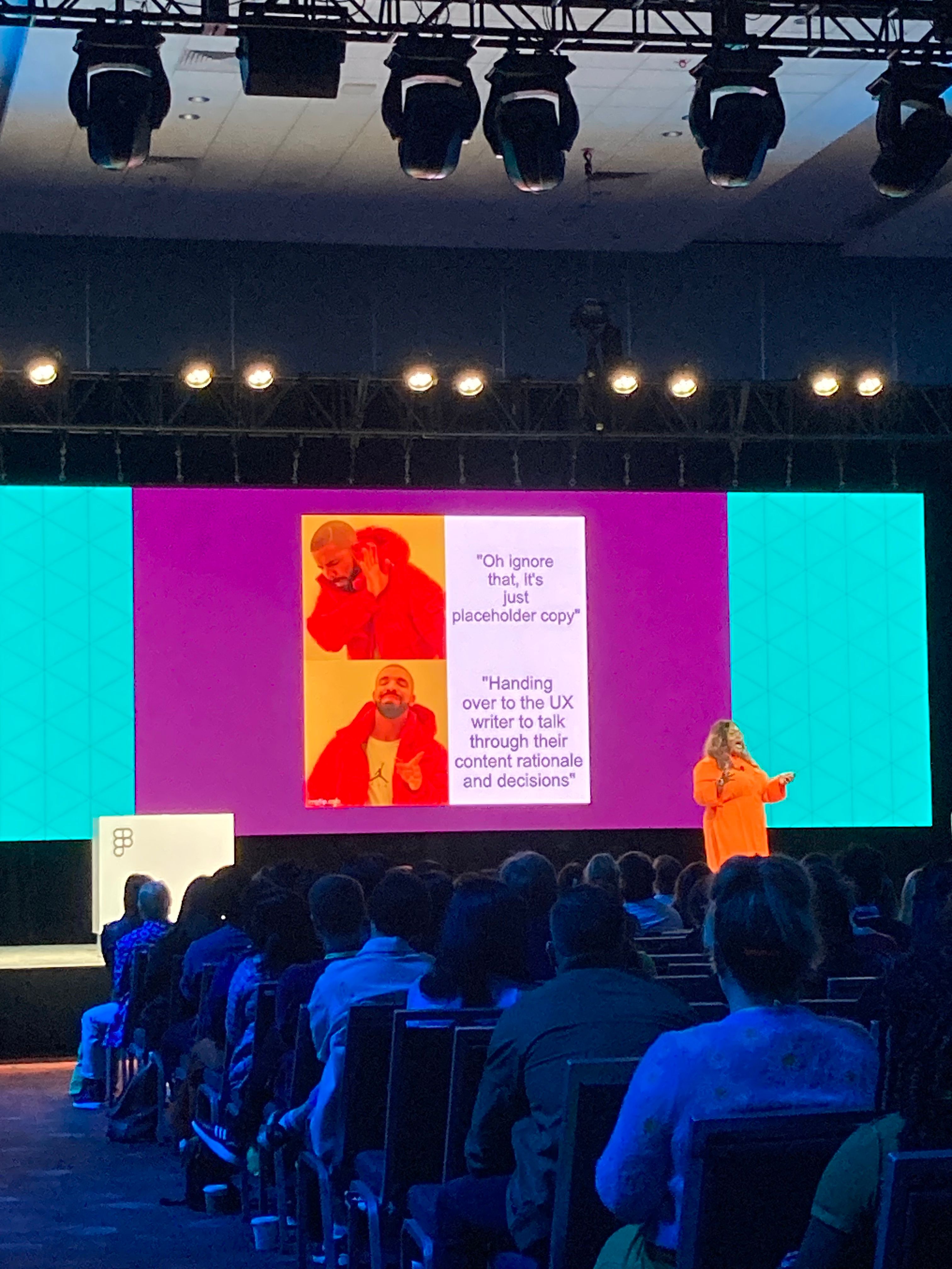 Candi Williams presents a talk onstage using a Drake meme.