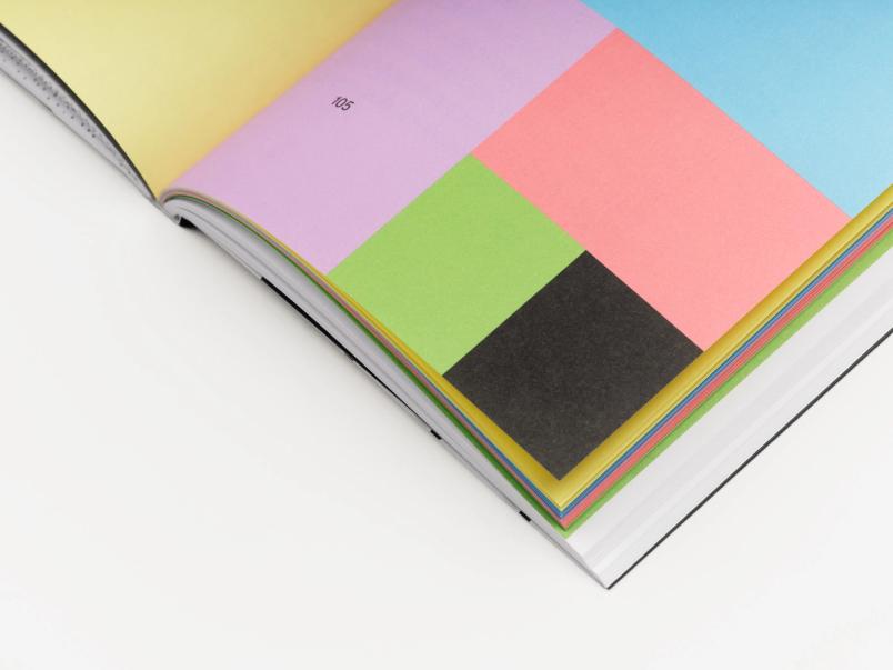 This is a striking, full-bleed color block spread using paper of different hues.