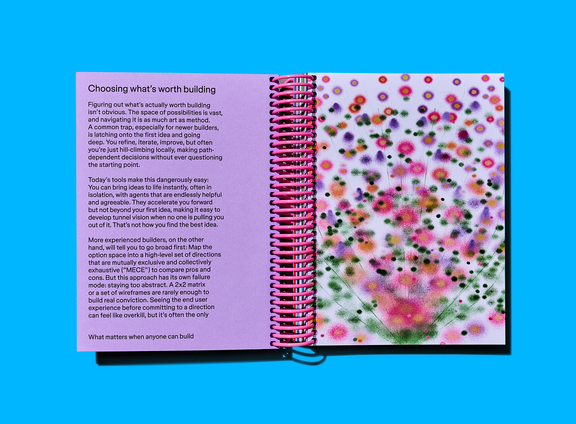 Open notebook pairs an article about choosing worthwhile ideas with a dreamy abstract floral illustration.
